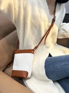 Retro color block canvas and leather crossbody bag for women, stylish small shoulder bag.