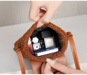 Plush phone bag detail view showing spacious interior capacity, retro brown crossbody design.