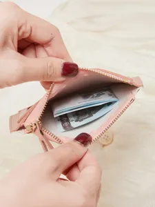 Pink mini zipper coin purse for women, slim short wallet with card slots and secure closure.