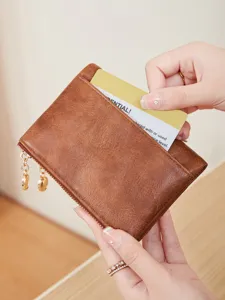 Women short brown leather wallet with double zippers and card slots, stylish casual purse.