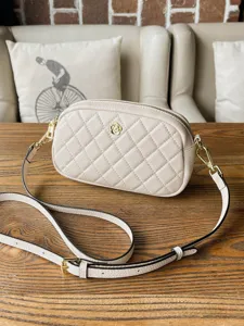 Mini quilted crossbody bag for women, stylish beige shoulder bag with chic flower logo.