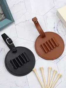 Detail view of portable PU leather golf tee holders in black and brown with wooden tees.