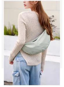 Detail view of the lightweight nylon dumpling crossbody bag, perfect for casual daily use.