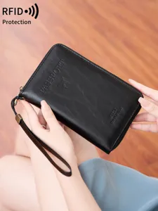 Portafoglio passaporto da viaggio in pelle PU con protezione RFID e comoda zip pratica.
