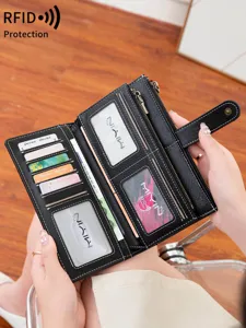 Vintage RFID blocking tri-fold long wallet for women with multiple card slots and zipper pocket.