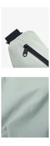 Close-up detail of lightweight nylon dumpling bag showing zipper and premium fabric texture.