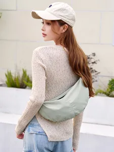 Lightweight nylon dumpling crossbody bag, trendy casual women's shoulder bag for daily use.