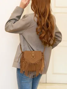 Bohemian fringe crossbody bag for women, retro suede shoulder bag with tassel details.