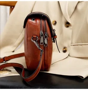 Classic brown PU leather women crossbody bag detail, double zipper retro style shoulder handbag.