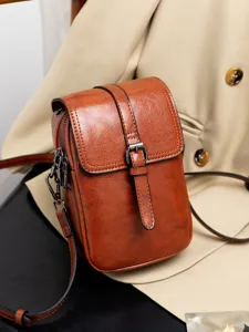 Vintage brown PU leather crossbody bag for women, stylish double-layer shoulder messenger bag.