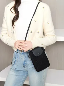 Cute black plush phone crossbody bag with leather flap for women daily casual outfits.