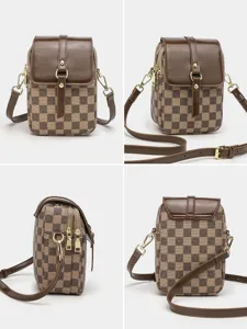 Women vintage checkered vertical crossbody bag with brown leather flap and double zipper.