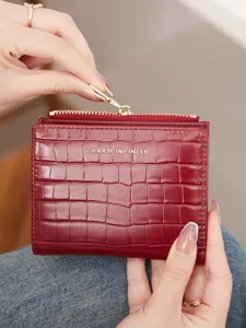 Women red crocodile pattern short wallet with zipper coin pocket and multiple card slots.