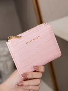 Pink crocodile pattern short wallet for women, two-fold zipper card holder and coin purse.