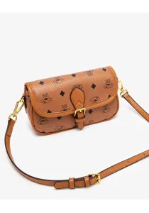 Close-up detail of the vintage brown monogram shoulder bag with gold hardware and flap design.