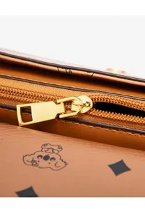 Brown leather women shoulder bag detail zoom featuring vintage monogram print and gold hardware.