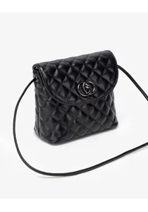 Black quilted leather crossbody bag detail shot, featuring metallic double-ring clasp.