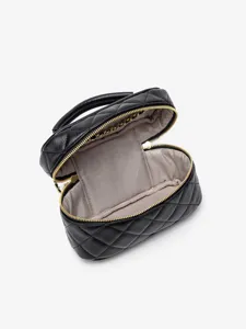 Black quilted leather vanity handbag with gold zipper and chain, stylish shoulder bag.
