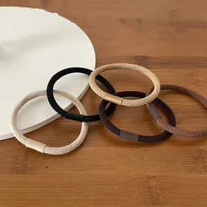 Detailed view of basic twill hair ties, simple elastic hair bands in assorted colors for daily wear.
