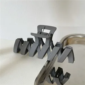 Matte grey geometric wave hair claw clip, large minimalist hair accessory for daily styling.