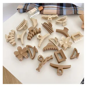 Matte neutral hair claws set, beige coffee hair clips for thick hair styling details view.