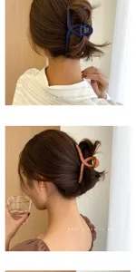 Close-up detail of large matte hair claw clip, stylish shark clip for women hair styling.