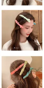 Detailed view of colorful seamless hair styling duckbill clips for salon and daily makeup use.