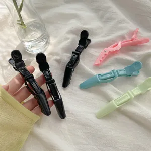 Multicolor hairdressing duckbill clips set for styling, sectioning, and salon hair care.