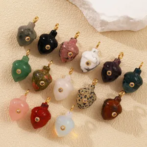 Natural gemstone acorn pendant detail, colorful stone jewelry charm with zircon inlay.