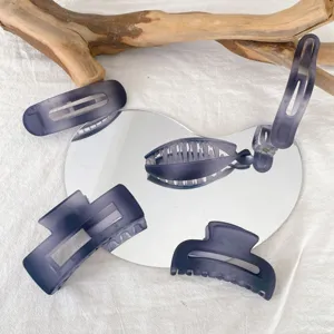 Set of matte navy blue hair claw clips and rectangular hair accessories for daily wear.