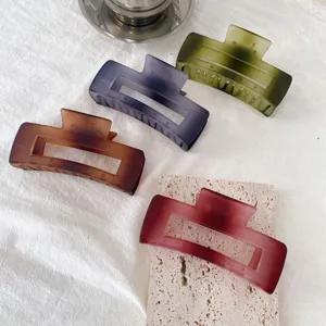 Large matte hair claw clips set, four stylish colors for daily styling and hair fixing.