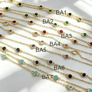 Close up of DIY jewelry semi-finished gold chains with colorful round cubic zirconia stones.