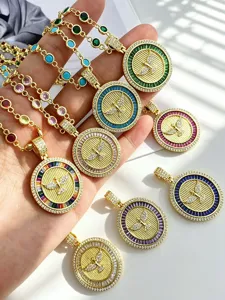 Gold plated coin pendant necklace set with colorful zirconia stones and crystal details.