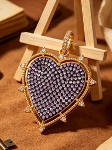 Gold heart shaped pendant charm with purple and white cubic zirconia for DIY jewelry making.