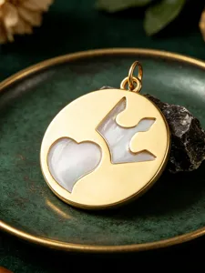 Gold pendant with mother of pearl heart and leaf inlay DIY jewelry accessory charm.