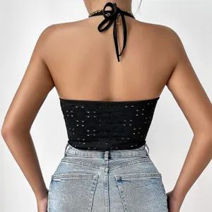 Stylish black halter crop top with sexy backless design and trendy cut-out details.