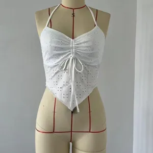 White halter crop top featuring eyelet embroidery, front ruching with drawstring, and chic hem.