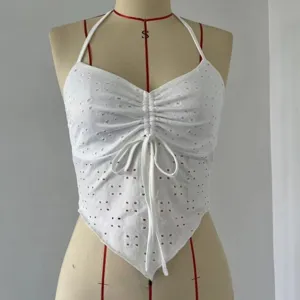 White halter crop top for women, sleeveless eyelet lace design with front drawstring detailing.