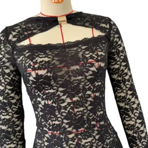 Sexy black lace long sleeve dress for women, elegant hollow out design with metallic buckle detail.