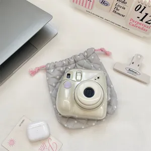 Detail view of the Korean style polka dot quilted drawstring storage bag for cameras.