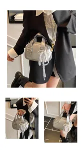 Silver soft leather shoulder bag with chic pearl lace charm for women daily casual style.