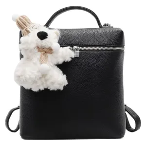 Stylish black litchi grain leather backpack for women with cute fluffy bear pendant daily wear