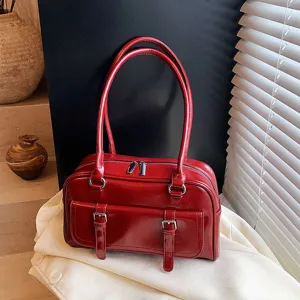 Red oil wax leather shoulder bag for women, stylish underarm pillow bag for daily commute.