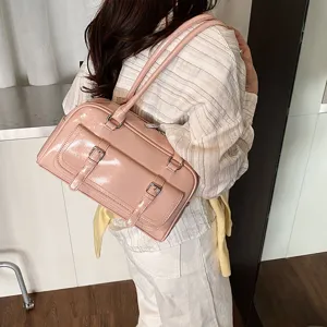 Pink patent leather shoulder bag for women, stylish underarm pillow bag with dual straps.