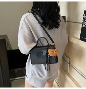 Stylish black PU leather crossbody handbag for women, chic top-handle daily shoulder bag.