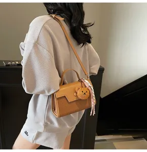 Stylish brown woven shoulder bag for women, chic top handle crossbody bag with cute bear charm