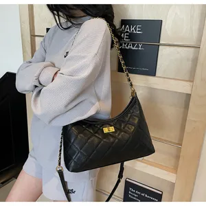 Vintage quilted leather shoulder bag with gold chain strap and chic turn-lock closure for women.