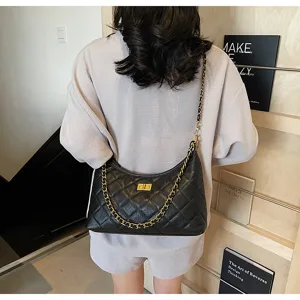 Detail view of a stylish black quilted hobo shoulder bag with chic gold chain and turn lock.