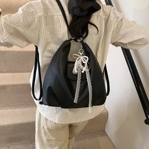 Women black leather backpack tote casual travel shoulder bag with pearl bow pendant main view
