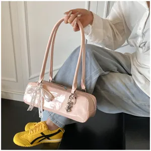 Pink patent leather baguette shoulder bag with white lace bow and heart charms chic stylish handbag